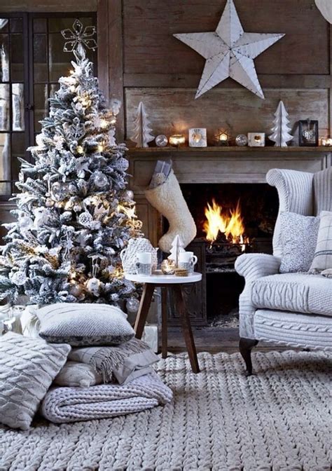 A Living Room Filled With Furniture And A Christmas Tree In Front Of A
