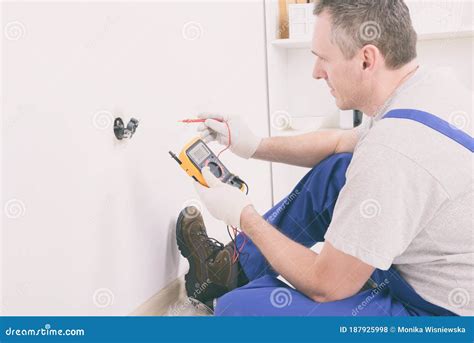 Electrician Checking Socket Stock Photo Image Of Professional
