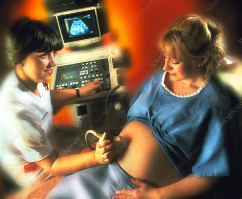 Ultrasound Scanning Of A Pregnant Womans Abdomen Stock Image M406