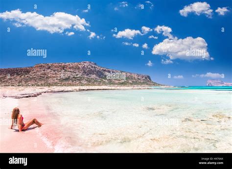 Balos Lagoon On Crete Island Greece A Girl On A Beach With Pink Sand