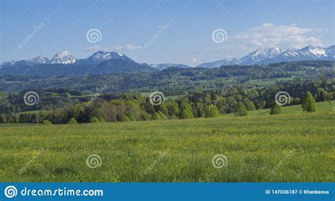 Beautiful Panoramic Spring Rural Mountain Landscape In The Bavarian