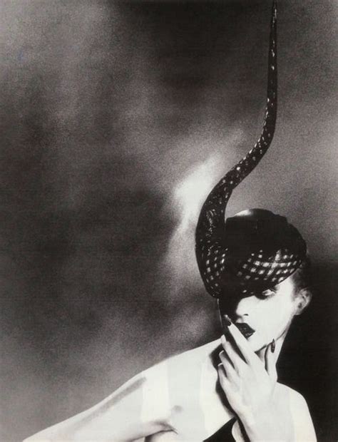 A Black And White Photo Of A Woman With A Snake Headdress On Her Head