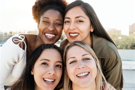 Multiracial Friends Having Fun Together Doing Selfie Outdoor Focus On African Girl Face Stock