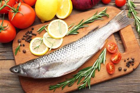 Premium Photo Fresh Raw Fish And Food Ingredients On Table