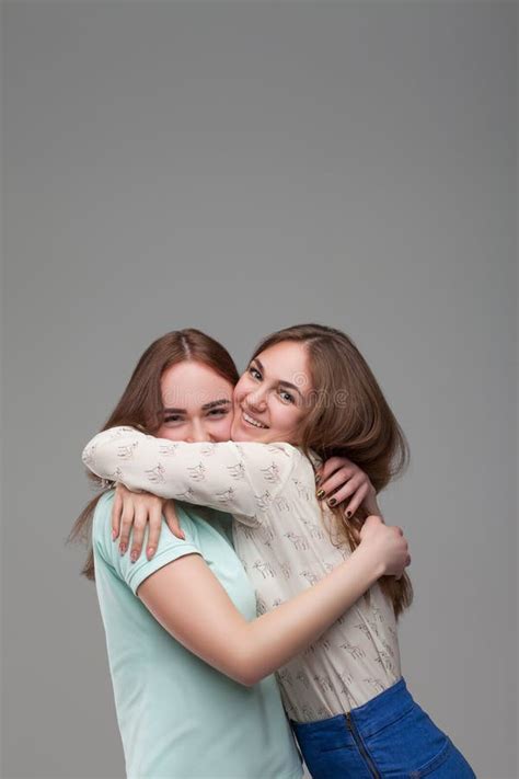 Two Women Hugs Together Studio Photo Shoot Stock Photo Image Of