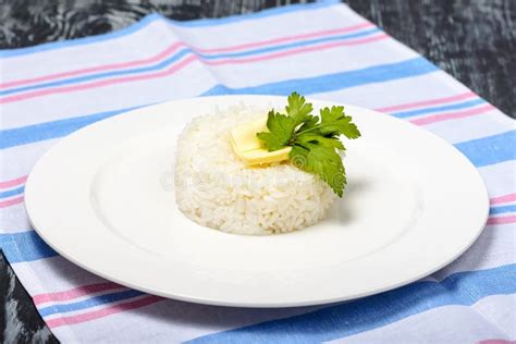 Garnish Of Boiled Long Grain Rice With Butter In Round Form Restaurant