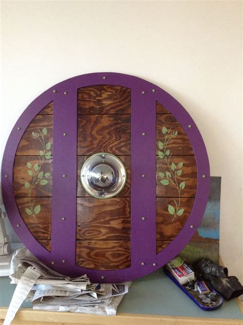Bringing high quality viking age replicas to you. Homemade Viking shield purple and green | Viking shield, Vikings, Bottle opener wall