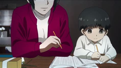 Two People Sitting At A Table With Books And Papers In Front Of Them One Person Writing