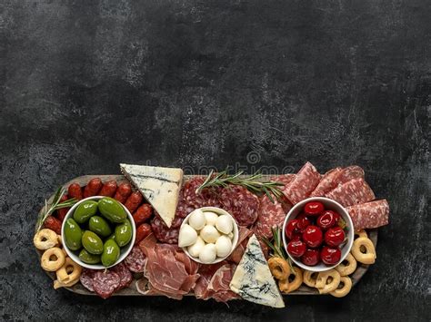 Charcuterie Board Or Italian Antipasti Of Assorted Cheeses Meats And