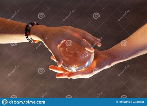 Couple Holding A Crystal Ball Together Stock Photo Image Of Hands