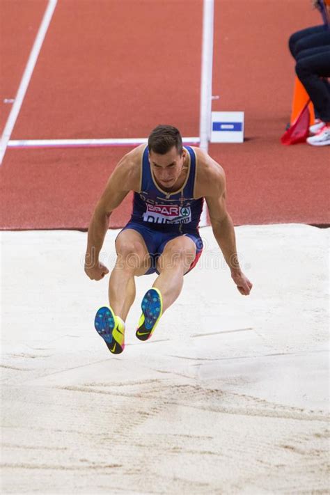 A heptathlon is a track and field combined events contest made up of seven events. Athletics - Man Long Jump Heptathlon Editorial Stock Photo - Image of event ...