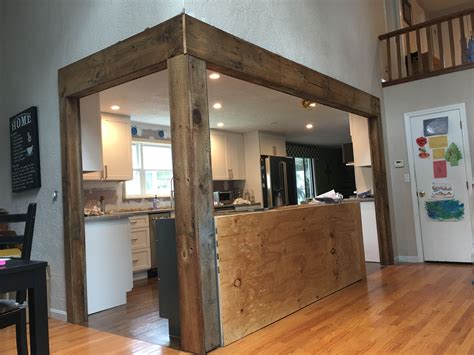 We Opened A Wall And Wrapped Our Beams In Reclaimed Barn Wood From The