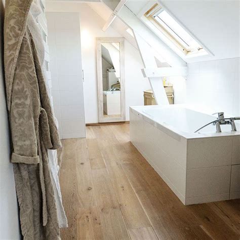 A projection of vertical walls through the sloped roof plane with a window and its own roof ties into the home's main roof. Attic Bathrooms With Sloping Walls / Modern Attic Bathroom ...