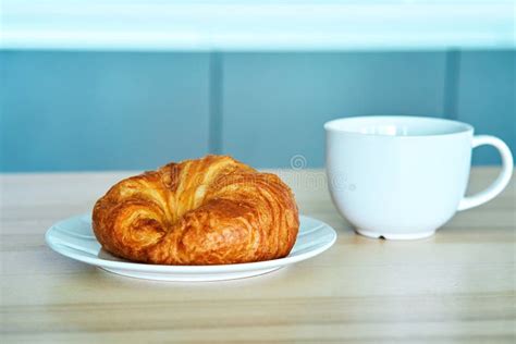 Breakfast In The Morning Croissant And A Cup Of Coffee Stock Image