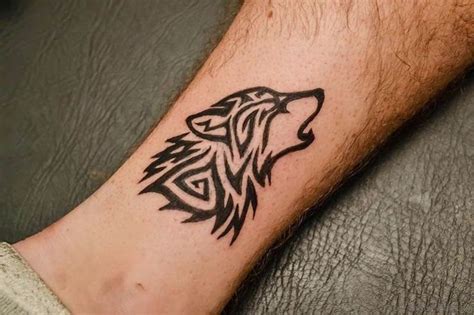Simple tribal wolf tattoo designs. 41 Marvelous Wolf Tattoos For Leg