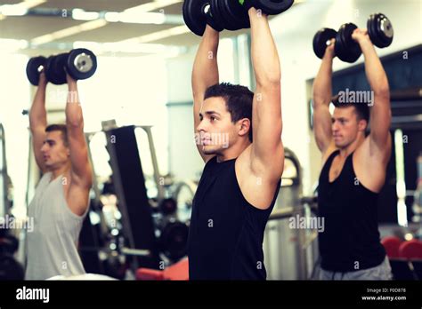 Group Of Men With Dumbbells In Gym Stock Photo Alamy