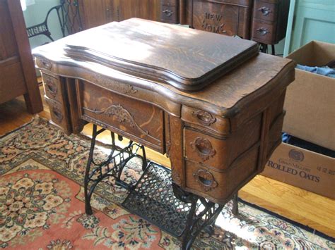 Fiberboard construction places any sewing cabinet in the 1960s at the earliest, while chrome and plywood were common in the 1950s. White Rotary Sewing Machine - Quiltingboard Forums
