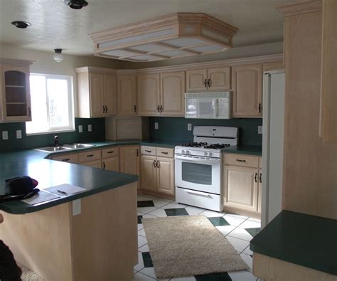 On wider frameless cabinets with four doors across (typically 42 or more) a center panel is present where the two center doors are mounted. Kitchen makeover. From partial overlay to inset.