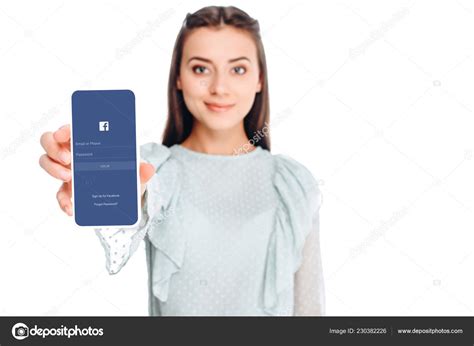 Young Woman Showing Smartphone Facebook Logo Screen Isolated White