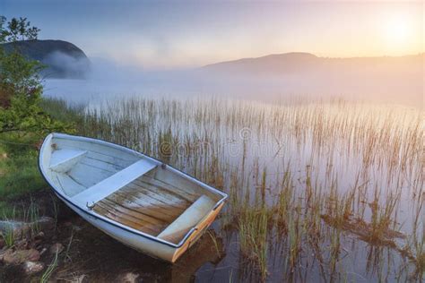 Boat On The Shore Of A Misty Lake Stock Photo Image Of Calm Nature