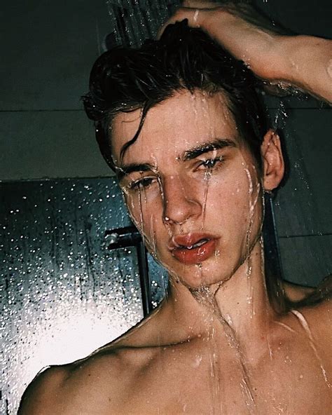 Young Man Washing Hair In Shower