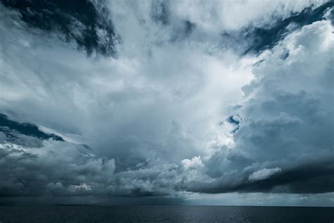 Dark Clouds In Open Ocean Tropical Hurricane And Sea