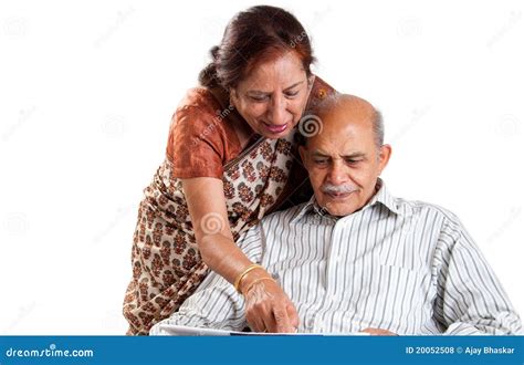 Senior Indian Couple On Cycle Ride In Countryside Royalty Free Stock