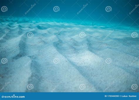 Underwater Shoot Of An Infinite Sandy Sea Bottom With Waves On A Sea