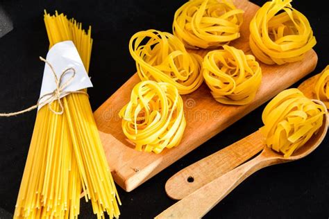 Raw Spaghetti And Tagliatelle Round Balls Of Pasta Stock Image Image