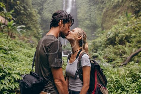 Couple In Love Kissing Near A Waterfall In Forest Jacob Lund Photography Store Premium Stock