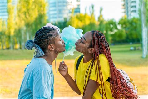 a happy black couple having colourful candy floss together stock image image of cotton city