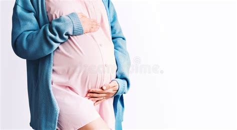 Pregnant Woman Holding Hands On Her Belly Pregnancy Gynecology Concept Stock Image Image Of
