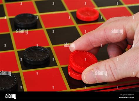 Playing Draughts Checkers Game On A Checker Board Stock Photo Alamy
