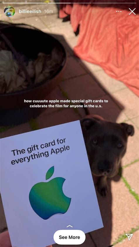 A Person Holding Up A Card With An Apple On It And The Caption Says