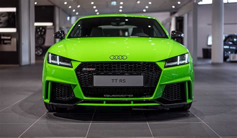 The iconic lines are there, but there's additional muscle as well—a signature rs singleframe® grille makes the sportiness known from the start, while a modified fixed wing rear spoiler and rs specific dual oval exhaust outlets leave a lasting impression. Lime Green 2017 Audi TT RS at Audi Forum Neckarsulm - GTspirit