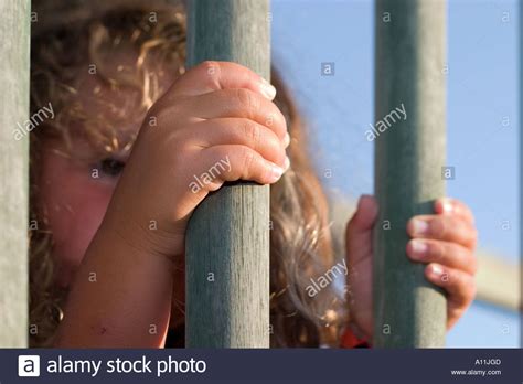 Young Child Behind Wooden Bars Stock Photo Alamy