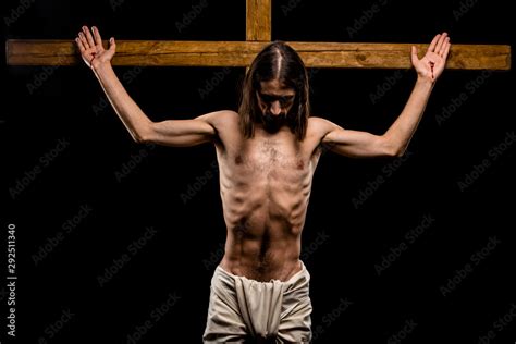 Shirtless Man Crucified On Cross Isolated On Black Stock Photo Adobe Stock