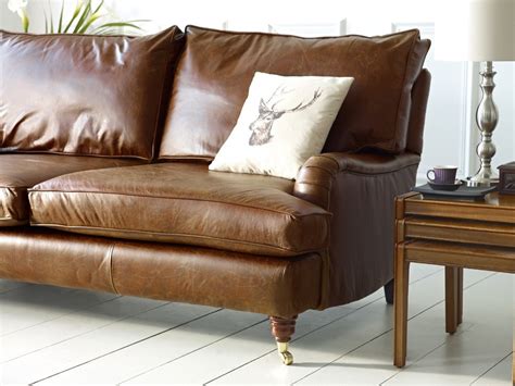 Since leather for a couch, chair, or bolster is usually thick, you can use white vinegar or rubbing alcohol solution (color check is still necessary, just in case). Downton Vintage Leather Sofa | The Chesterfield Company