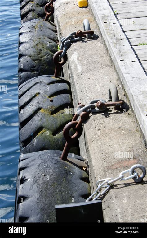 Tires Chained Pier Stock Photo Alamy