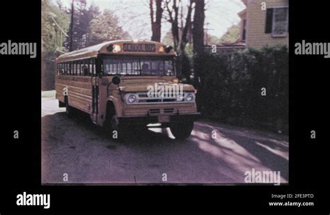 1970s School Bus Pulling Up To Local Grocer To Pick Up Children