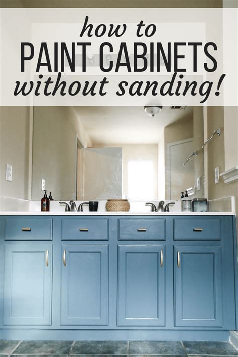 A Bathroom With Blue Cabinets And The Words How To Paint Cabinets