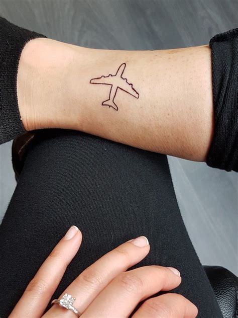 Attractive plane tattoo on wrist. Airplane tattoo | Airplane tattoos, Tattoos, Plane tattoo