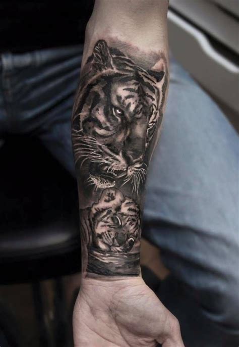 Black And Grey Style Tiger And Baby Tiger Tattoo On The Left Inner