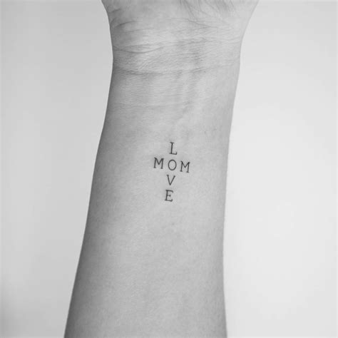 Mom Love Lettering Tattoo Located On The Wrist