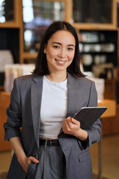 Young Professional Leader Asian Business Woman Wearing Suit Vertical