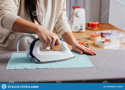 Process Of Ironing Textile Before Cutting The Pattern And Sewing Stock