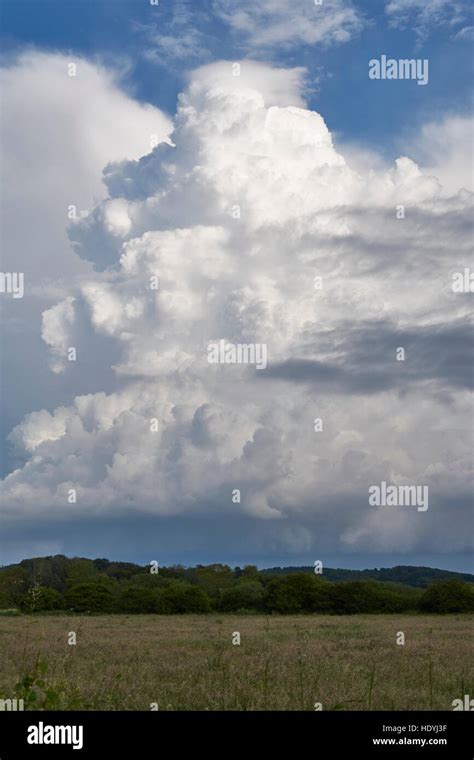 Towering Stacked Cumulonimbus Clouds Over Wiveton In North Norfolk Mid