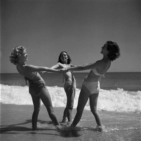 daring women wearing bikinis and playing ring around the rosy early 1940s vintage swimsuits