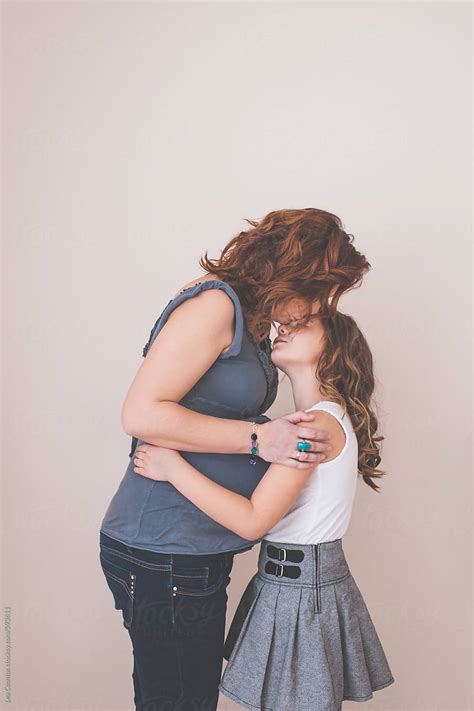 Pregnant Mother Hugging And Kissing Her Daughter By Stocksy Contributor Lea Csontos Stocksy