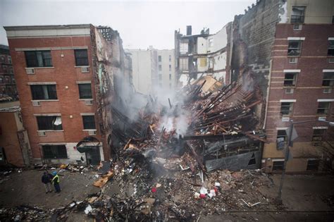 The cause of the first blast, which one witness said was like a volcano, was believed to have. New York City firefighters work at the site of a building ...